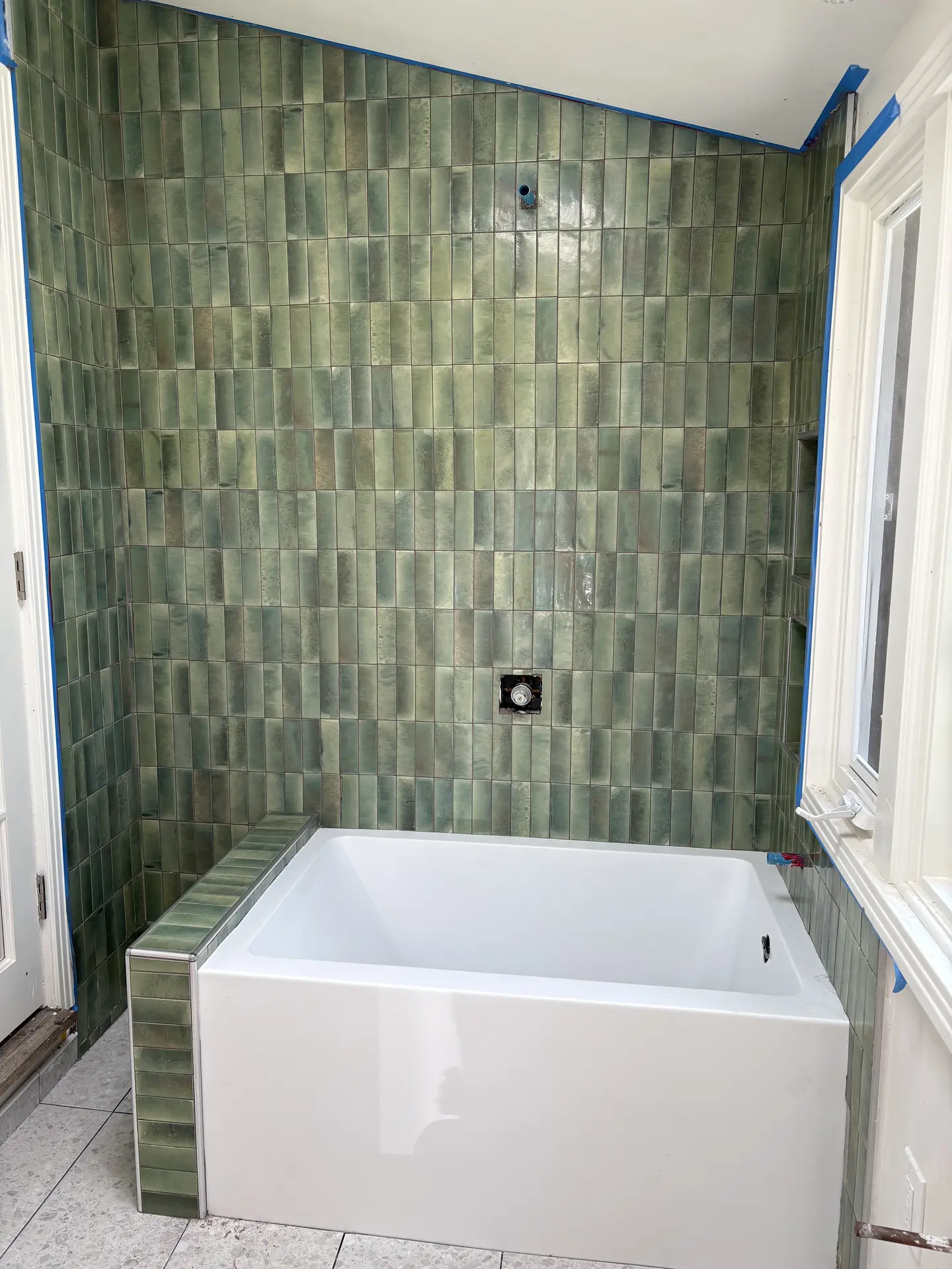 Vertical green tile bath surround installed by C-TILE Custom Work