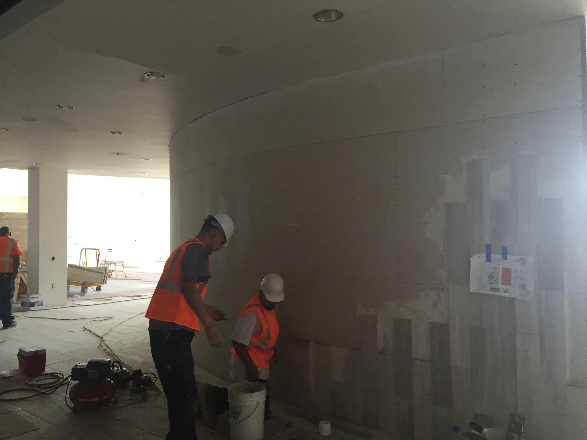 C-TILE installation crew working on a custom wall surface