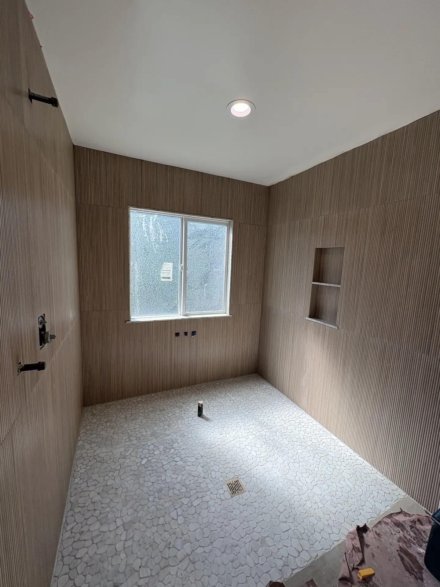 Textured wall tile shower installation by C-TILE Custom Work